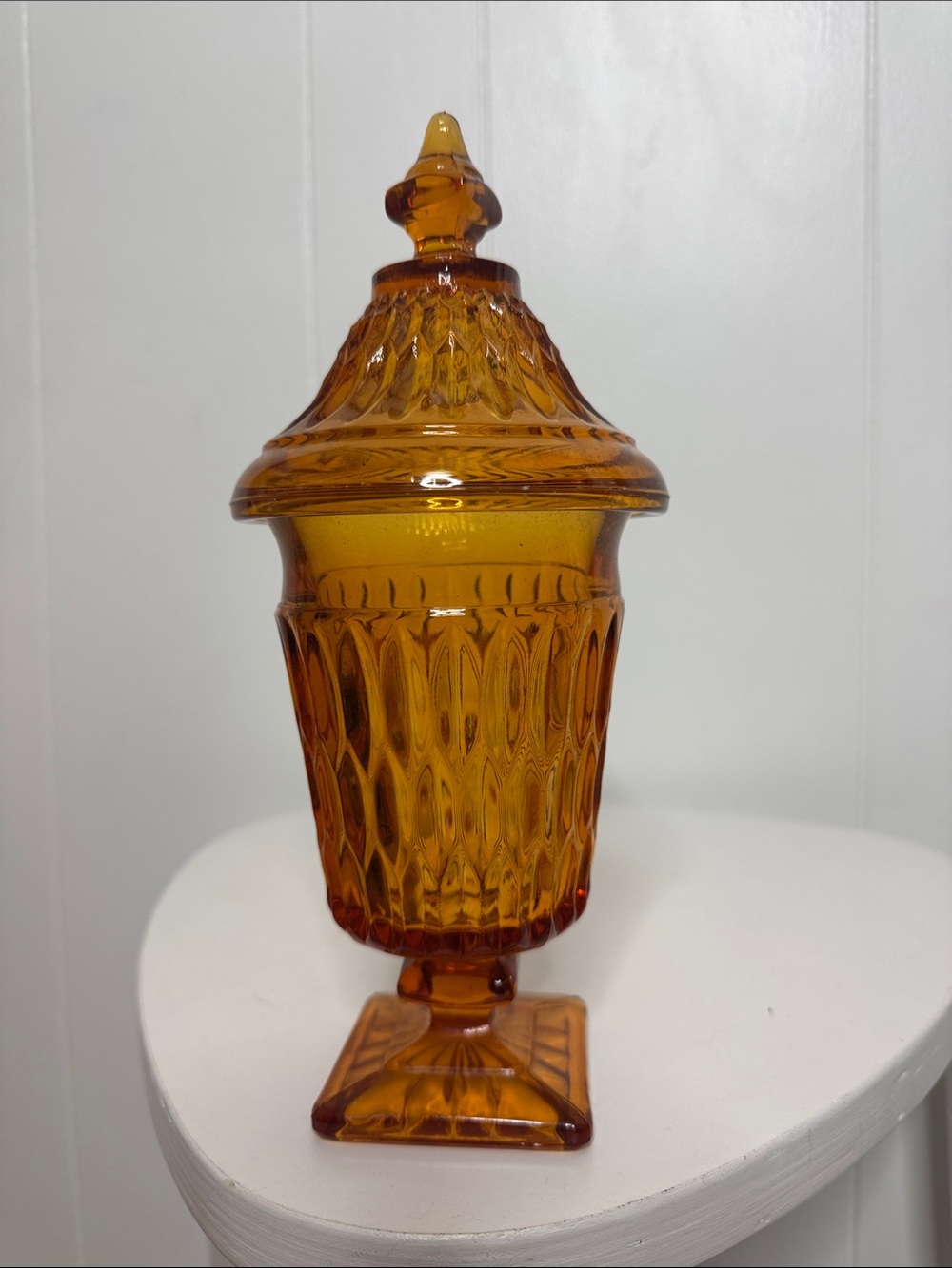 Orange glass pedestal candy dish